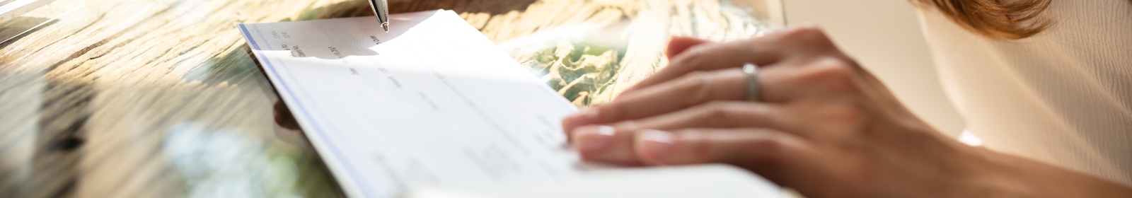 person writing a check